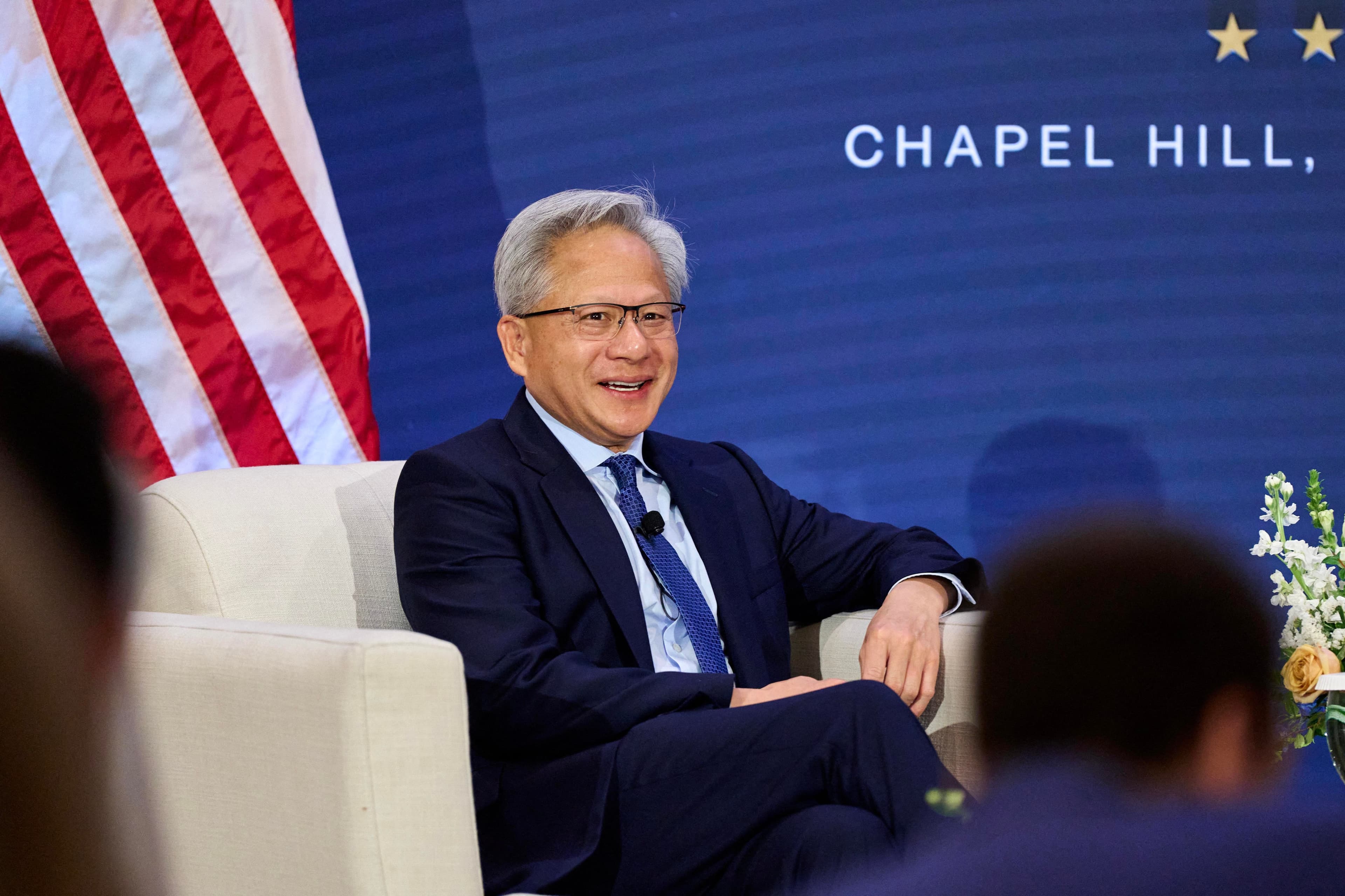 Jensen Huang puts Trump on speakerphone onstage to announce robots won’t take over the world
